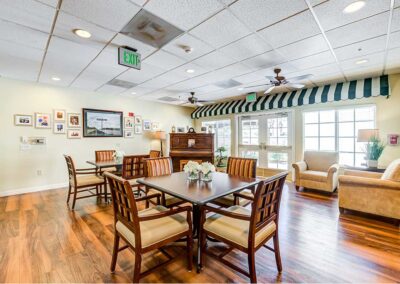 dining area with wooden flooring and piano