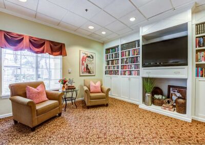 carpeted living room area with television